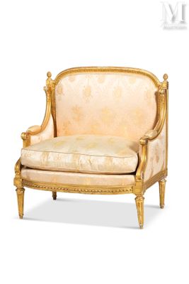 a gold colored chair with a beige upholstered seat