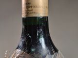 a bottle of wine that has been wrapped in plastic