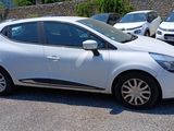 a white car that is parked in a parking lot