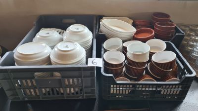 many cups and containers that are sitting on a table