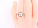 an image of a woman ' s hand with a diamond ring on it