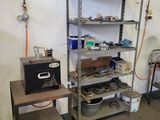 a room with a shelf and a table with tools on it