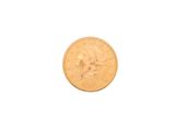 a close up of a gold coin on a white background
