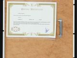 a picture of a picture of a certificate on a bulletin board