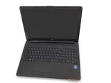 a black laptop computer sitting on top of a white surface