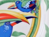 a plate with two birds painted on it