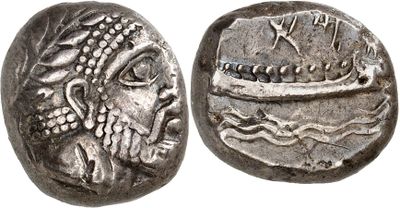 a silver coin with an image of a boat on it