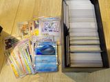 many cards in a black box on a wooden table