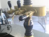 a blue and gold tea kettle on a black table