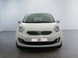 the front view of a white car in a white room