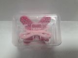 a plastic container that has a pair of pink bunny ears in it