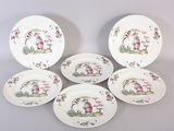 six plates with different designs on them sitting on a table