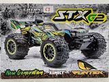 une image représentant un monster truck miniature dans une boîte