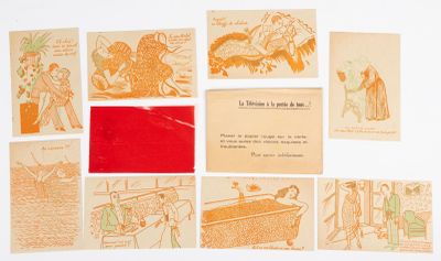 a lot of old postcards that are on the table