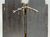 two pieces of wood with a rope tied to them