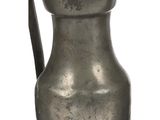 an old metal pitcher with a handle on a white background