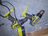 two electric tools that are laying on the floor