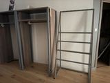 a ladder that is leaning against a wall in a room