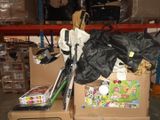 a pile of assorted items sitting on top of a cardboard box