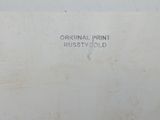 a sign on the wall that says original print rusty gold
