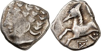 a silver coin with a horse on the front and a horse on the back