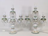 three candelabs that are sitting on a table