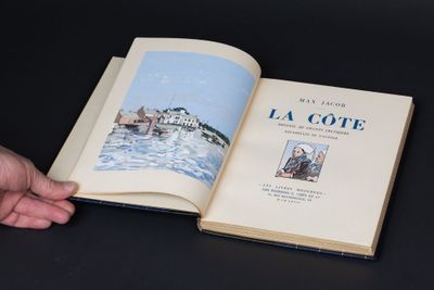 a person holding an open book with a picture on it