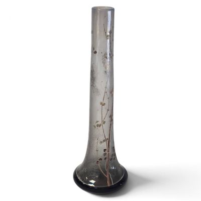 a glass vase that is sitting on a table