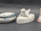 five different types of porcelain objects on a table