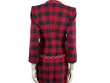 a mannequin wearing a red and black plaid dress and jacket