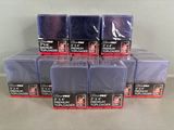 several packs of blue and purple cards are stacked on top of each other