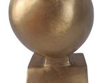 statue of a golden bird on a square base on a white background