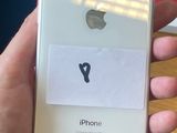 someone is holding an iphone with a sticker on the back of it