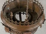 a small metal object with a crown on top of it