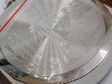 a close up of a watch on a white surface
