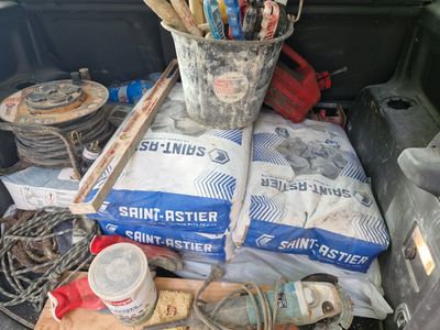many items in the back of a truck that is full of stuff