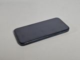 a close up of a cell phone on a table with a white background