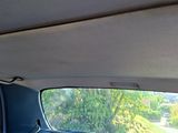 a view of the inside of a car from the passenger seat
