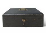 an old black suitcase with a lock on the inside