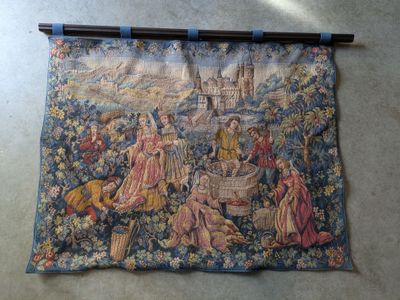 an image of a tapestry hanging on the wall of a room