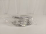 a spool of wire wrapped in plastic on a table