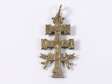 an image of a gold cross on a white background