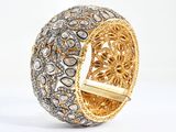an image of a close up of a ring with diamonds on it