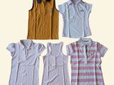 four different types of women ' s polo shirts arranged in a row