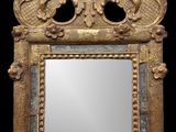 une image représentant un miroir à cadre doré sur fond noir