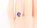 an image of a woman ' s hand with a ring on it
