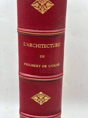 une image représentant un livre rouge orné d'inscriptions dorées