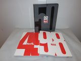 a book on a table with a phone on it