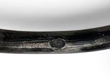 a close up of a knife on a white surface