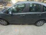a picture of a small car parked in a parking lot